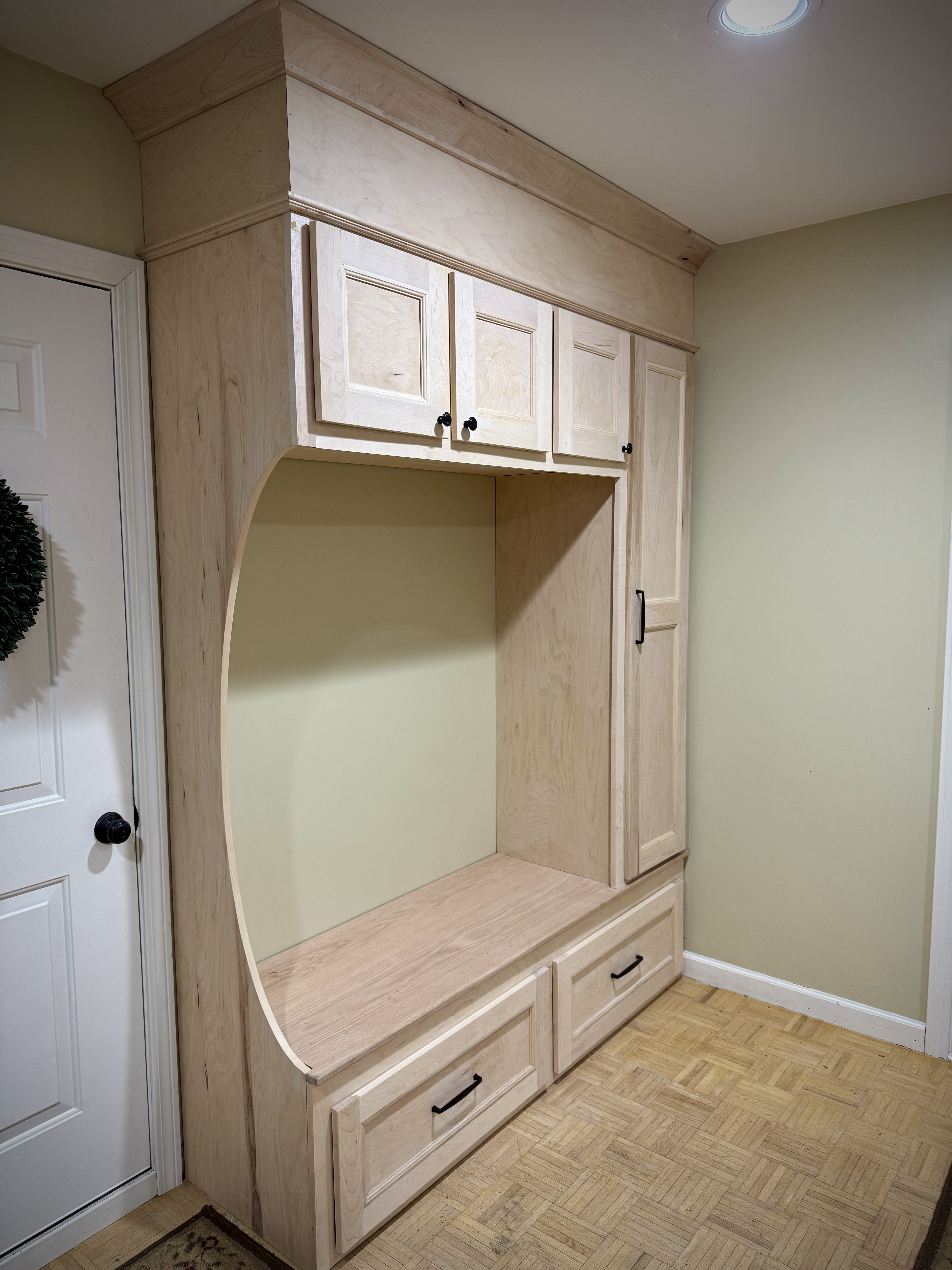 Maple mudroom built-in bench with drawers, cabinets and coat hooks in East Greenwich, RI